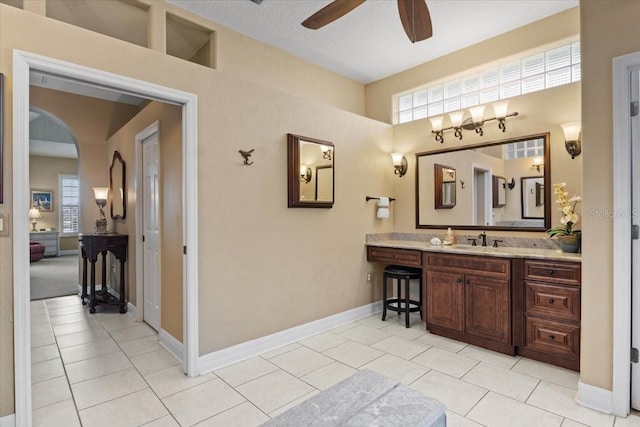 bathroom with tile patterned flooring, ceiling fan, and vanity