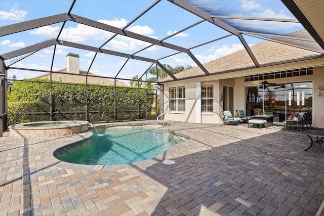 view of swimming pool featuring a lanai, an in ground hot tub, ceiling fan, and a patio