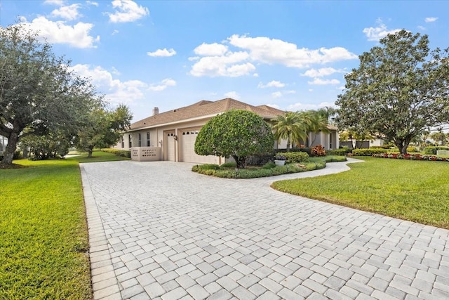 ranch-style home with a front lawn and a garage