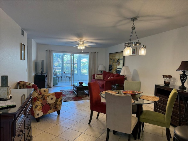 dining space with ceiling fan and light tile patterned floors