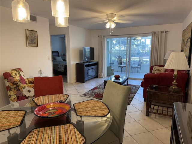 tiled living room featuring ceiling fan