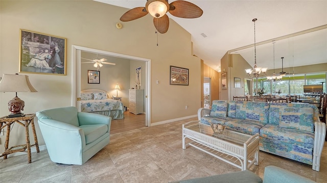 living room featuring high vaulted ceiling and ceiling fan with notable chandelier