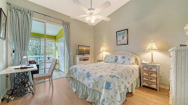 bedroom featuring vaulted ceiling, ceiling fan, light hardwood / wood-style floors, and access to outside