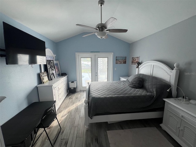 bedroom with french doors, light wood-type flooring, access to outside, vaulted ceiling, and ceiling fan