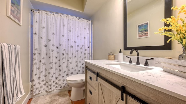 full bath featuring toilet and vanity