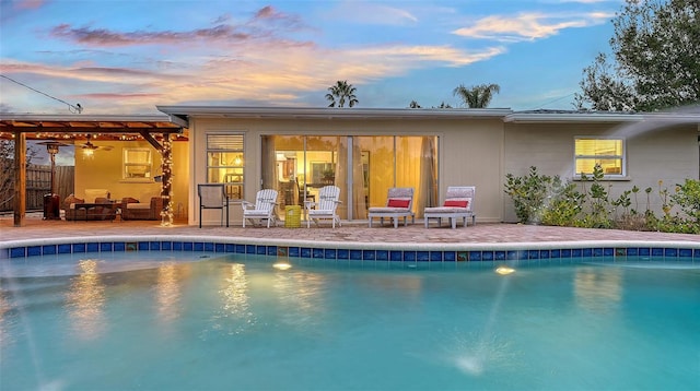 pool with fence and a patio