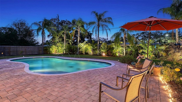 view of pool featuring a patio area, fence, and a fenced in pool