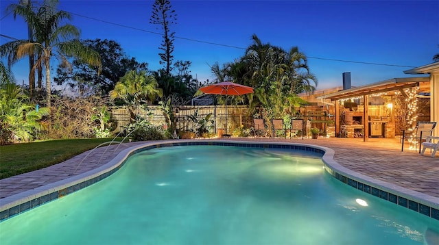 view of swimming pool with a fenced in pool, a patio, and fence