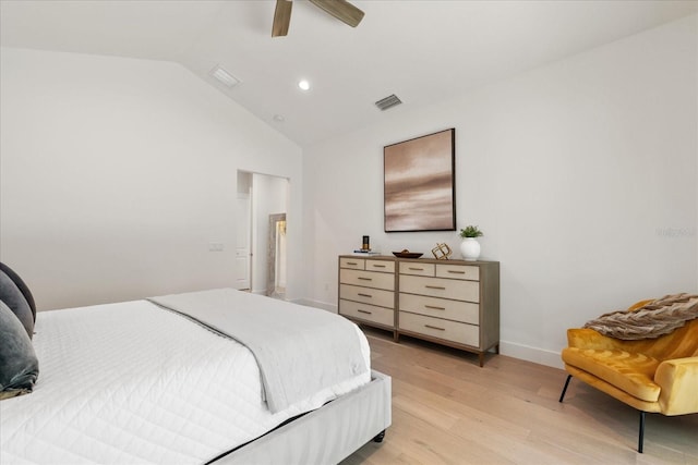 bedroom featuring ceiling fan, lofted ceiling, and light wood-type flooring