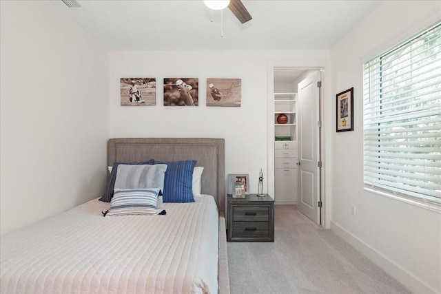 carpeted bedroom featuring ceiling fan