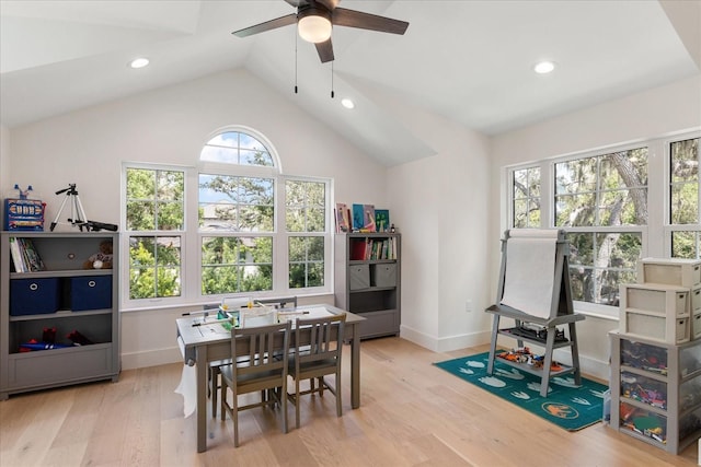 playroom featuring ceiling fan, lofted ceiling, and light wood-type flooring