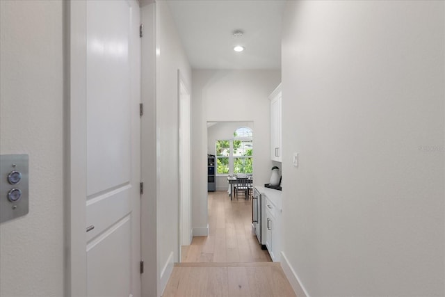 corridor featuring light wood-type flooring