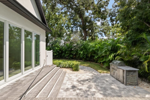 view of patio with area for grilling and exterior kitchen