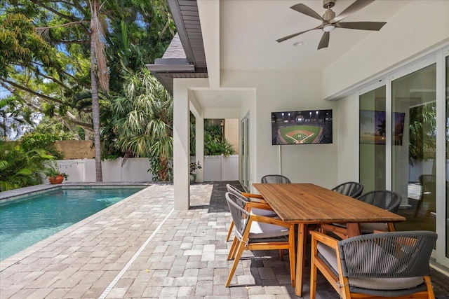 view of pool with a patio area and ceiling fan