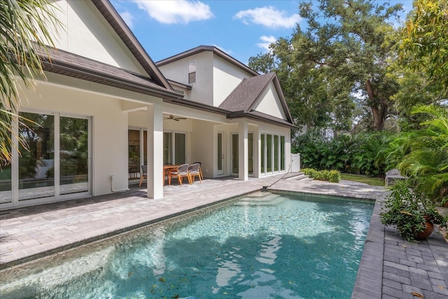 view of pool featuring a patio and ceiling fan