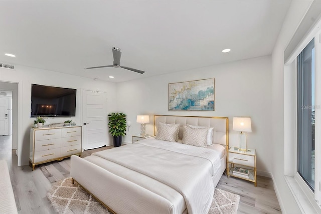 bedroom featuring light hardwood / wood-style floors and ceiling fan