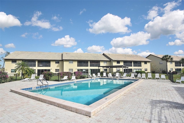 view of swimming pool with a patio