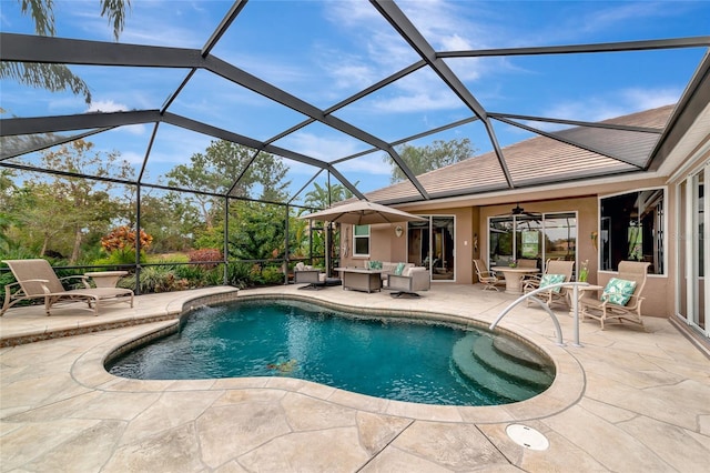 view of swimming pool with a patio area, an outdoor living space, ceiling fan, and glass enclosure