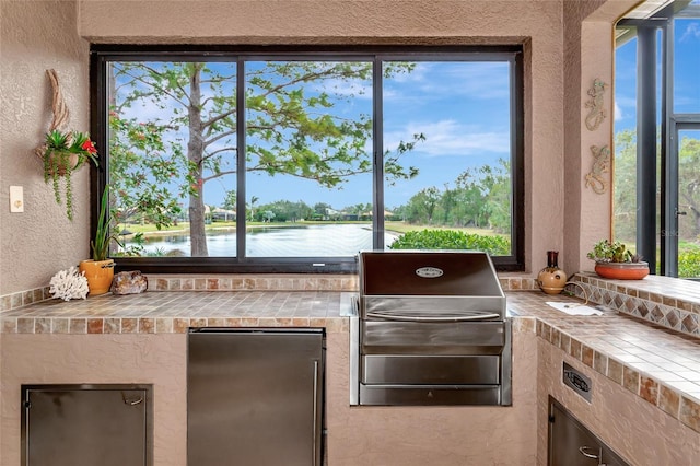 view of patio / terrace featuring a water view