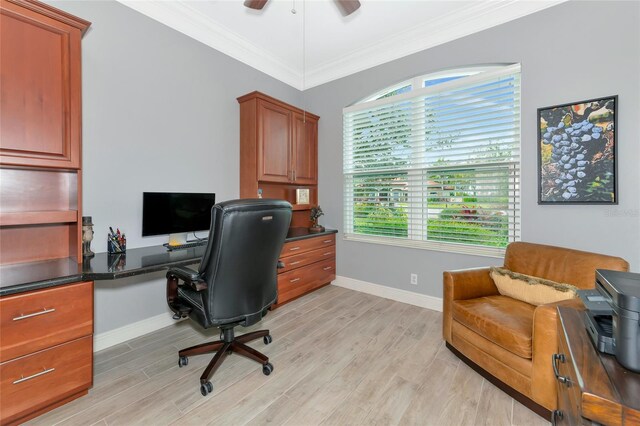 office space featuring crown molding, ceiling fan, baseboards, and light wood-style floors