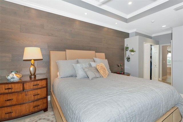 bedroom featuring visible vents, ornamental molding, a closet, wooden walls, and recessed lighting