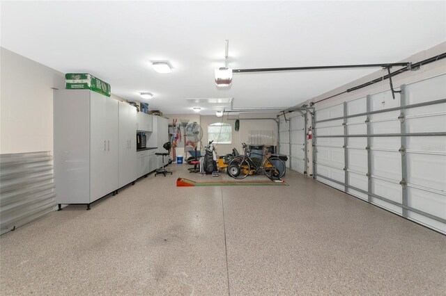garage featuring a garage door opener