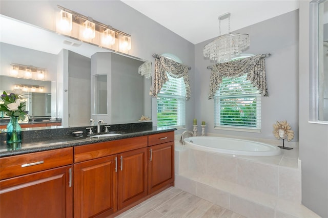 16806 5th Ter NE, Bradenton, FL 34212 - bathroom featuring a garden tub and vanity