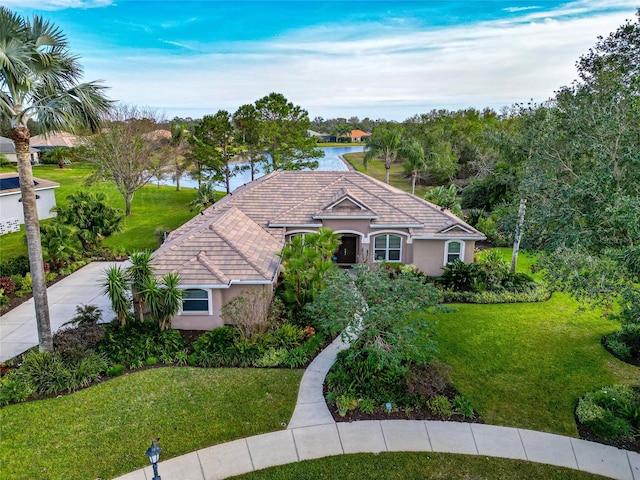 16806 5th Ter NE, Bradenton, FL 34212 - view of front of house featuring a front lawn, stucco siding, and a tile roof