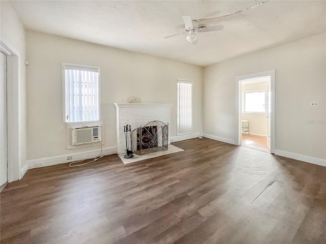 unfurnished living room with hardwood / wood-style flooring and ceiling fan