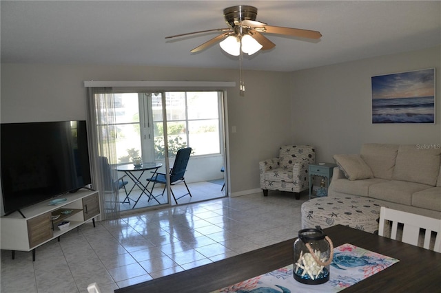 tiled living room with ceiling fan