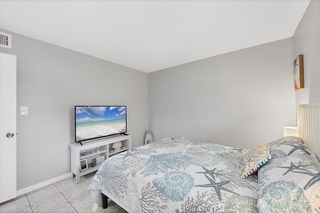 bedroom featuring light tile patterned floors