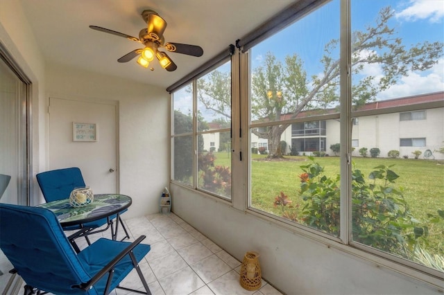 sunroom / solarium with a wealth of natural light and ceiling fan