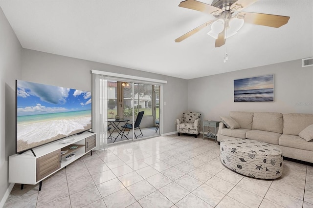 living room featuring light tile patterned flooring and ceiling fan