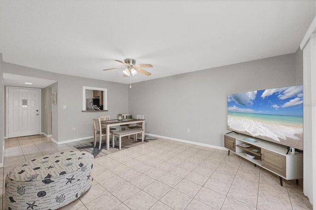 tiled dining room featuring ceiling fan