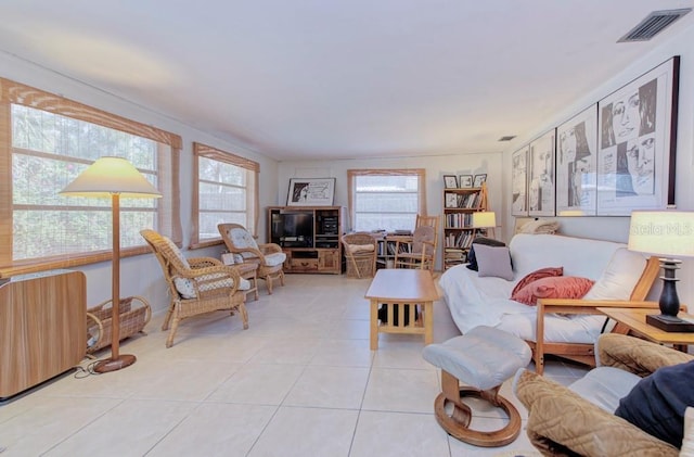 tiled living room with a wealth of natural light