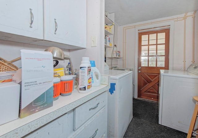 laundry room with cabinets and washer and clothes dryer