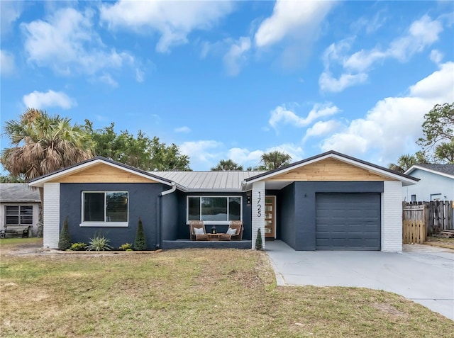 ranch-style house with a front yard and a garage