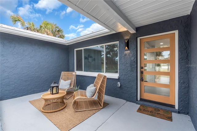 property entrance with a patio area