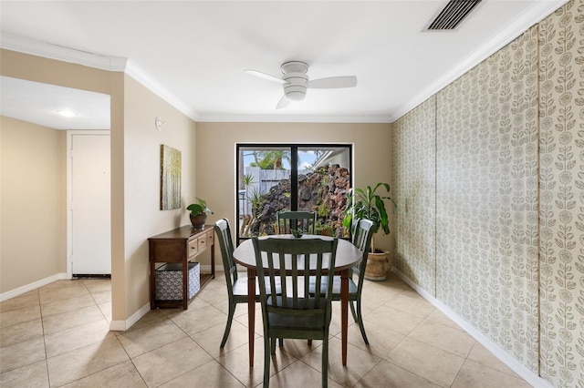 dining room with crown molding, ceiling fan, and light tile patterned flooring