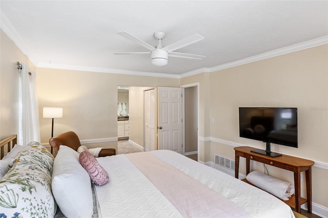 bedroom with ornamental molding, connected bathroom, and ceiling fan