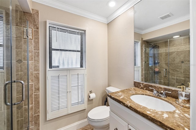 bathroom with crown molding, vanity, walk in shower, and toilet