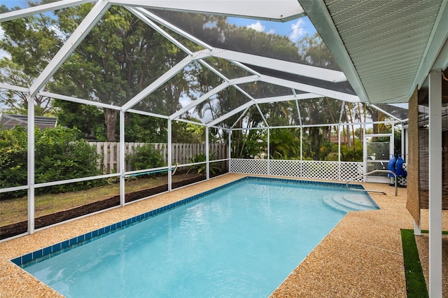 view of pool with a lanai