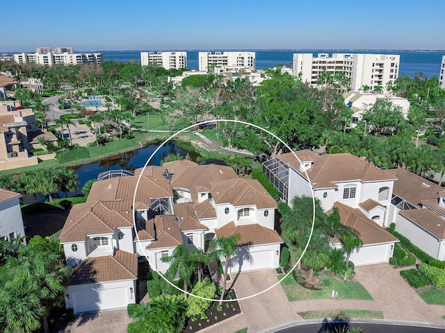 birds eye view of property with a water view