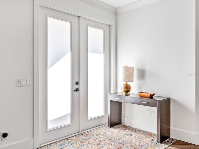 entryway with french doors and crown molding