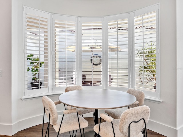 dining room with dark wood-type flooring