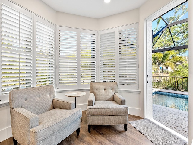 living area with hardwood / wood-style flooring