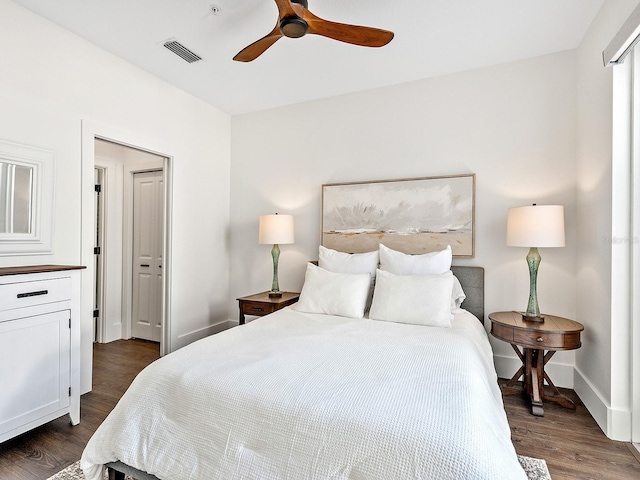 bedroom featuring dark wood-type flooring and ceiling fan