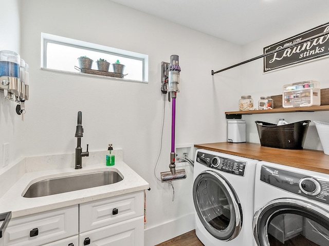 washroom featuring washer and clothes dryer and sink