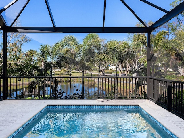 view of pool with a water view