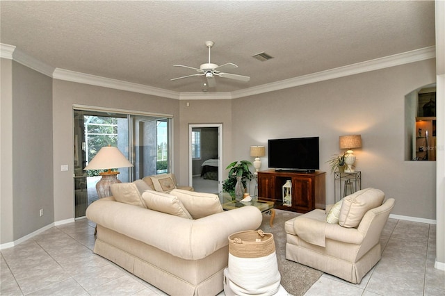 living room featuring ceiling fan, light tile patterned flooring, crown molding, and a textured ceiling